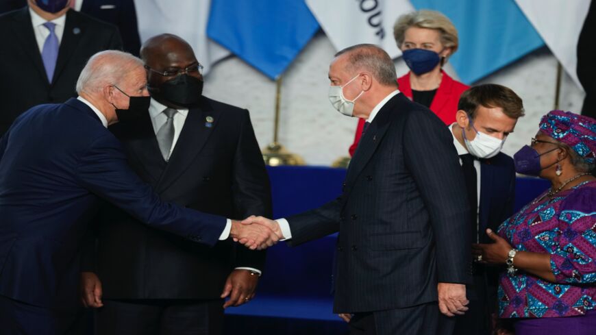 US President Joe Biden (L) greets Turkey's President Recep Tayyip Erdogan.