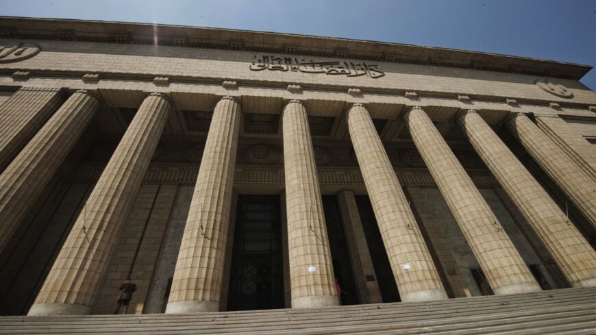 People walk in and out of the Cairo High Court in Egypt on Aug. 25, 2013.