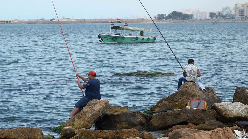 Egyptians fish on the seaside in the coastal city of Alexandria, Egypt, May 21, 2016.