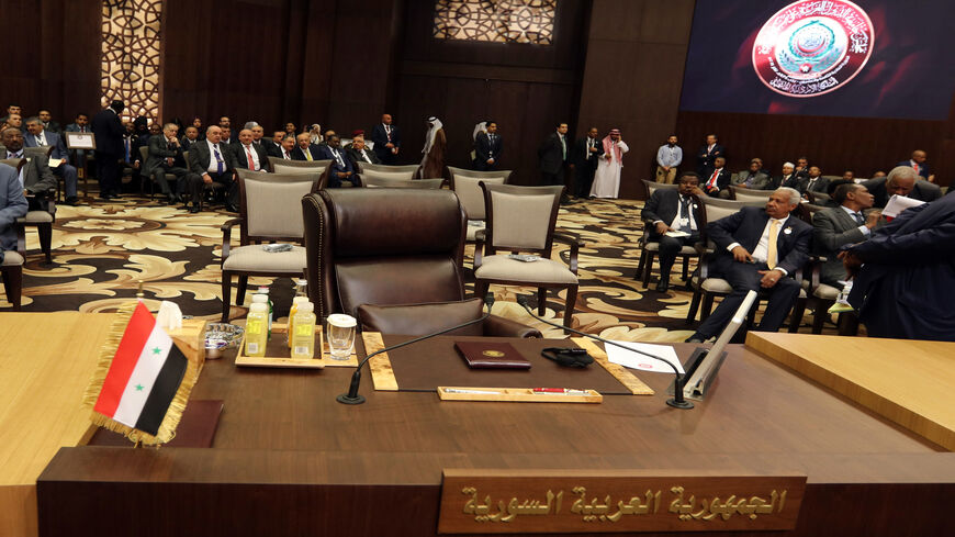 The empty seat of the representative of Syria is seen during the Arab League summit, Sweimeh, Jordan, March 29, 2017.