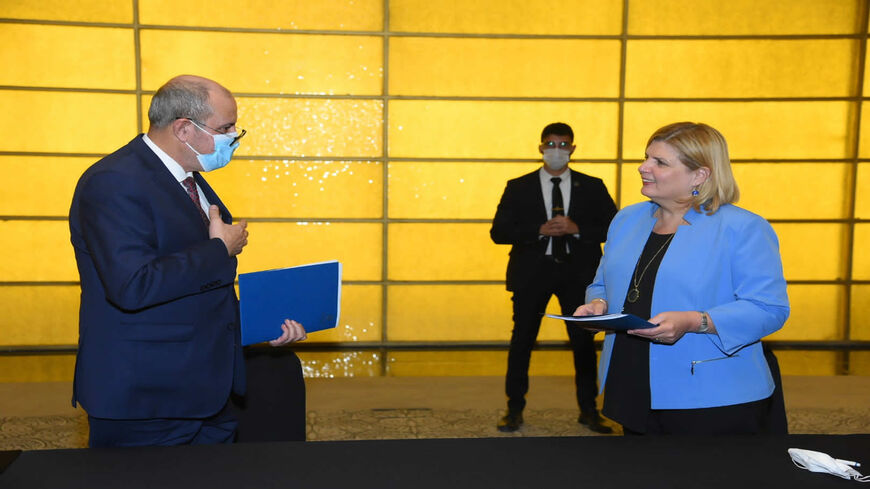 Israeli Economy Minister Orna Barbivai (R) and Jordanian Minister of Industry, Trade and Supply Yousef Alshamali meet in Amman, Jordan, Nov. 3, 2021.