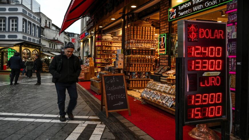 A man walks past a currency exchange agency near Grand Bazaar in Istanbul on Nov. 24, 2021, in Istanbul.