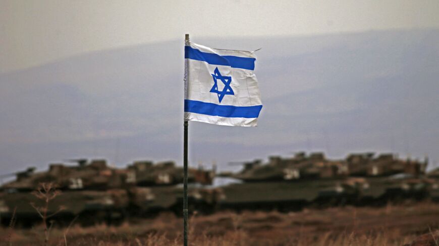 Israeli tanks are seen in action during a military drill near Ramat Trump settlement in the Israel-annexed Golan Heights on Dec. 7, 2021.