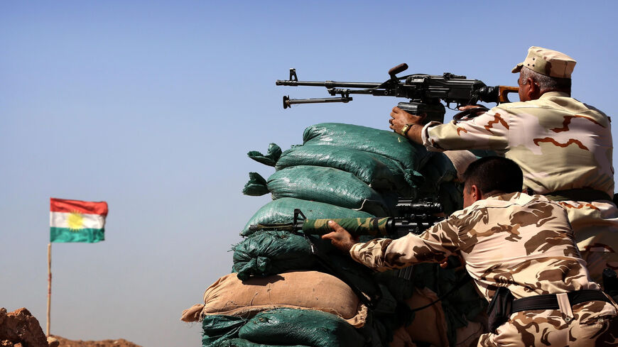 Peshmerga fighters hold a position behind sandbags at a post in the strategic Jalawla area, in Diyala province, which is a gateway to Baghdad, as battles with the Islamic State continue, Sept. 27, 2014.