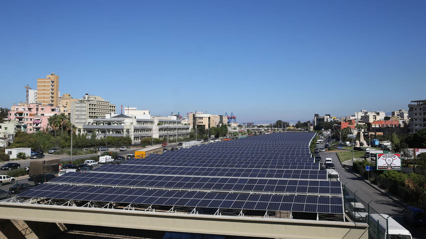 Solar panels are seen above the river bed in Beirut, Lebanon, Nov. 12, 2015.