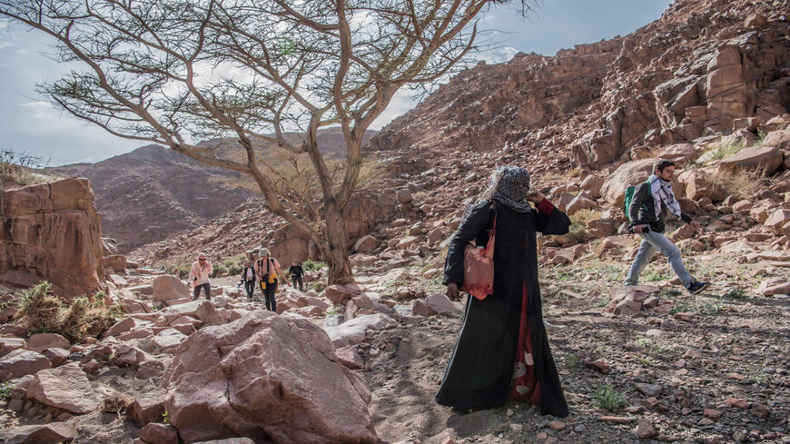 Umm Yasser (2nd-R), an Egyptian Bedouin female guide from the Hamada tribe, leads a group of hikers in Wadi el-Sahu in the southern Sinai governorate, during the first Sinai Trail led by Bedouin female guides, Egypt, March 29, 2019.