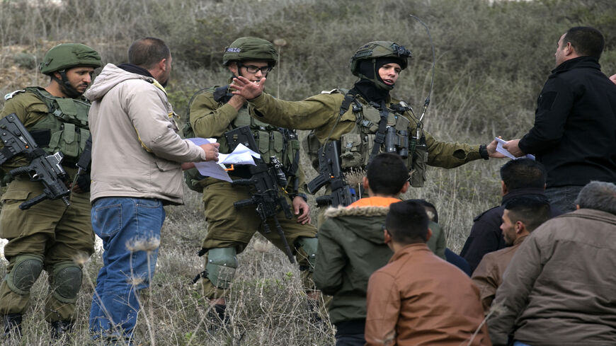 Israeli soldiers scuffle with Palestinians in the village of Burqa, northwest of the city of Nablus, following a weekly demonstration against the expropriation of Palestinian land by Israel, West Bank, Dec. 13, 2019.