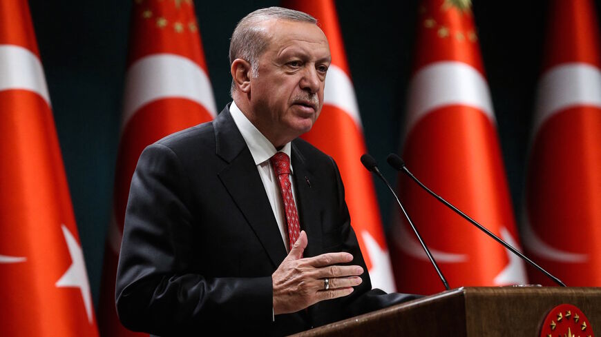 Turkish President Recep Tayyip Erdogan gestures as he delivers a speech following a cabinet meeting, in Ankara, on June 9, 2020.