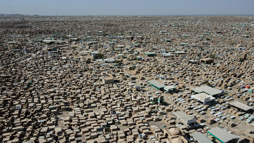 An aerial view shows Wadi al-Salam cemetery in the holy city of Najaf, as Muslims celebrate Eid al-Adha, Iraq, July 21, 2021.