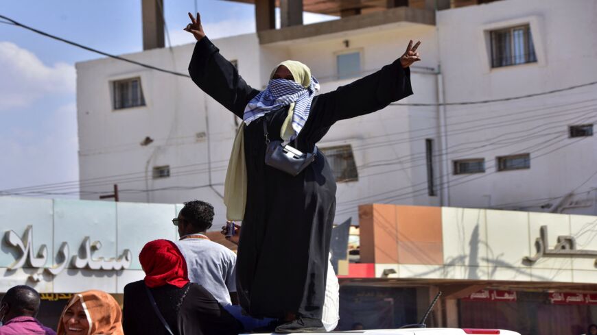 A Sudanese woman takes part in a protest in the city of Khartoum Bahri to demand the government's transition to civilian rule, on Oct. 21, 2021.