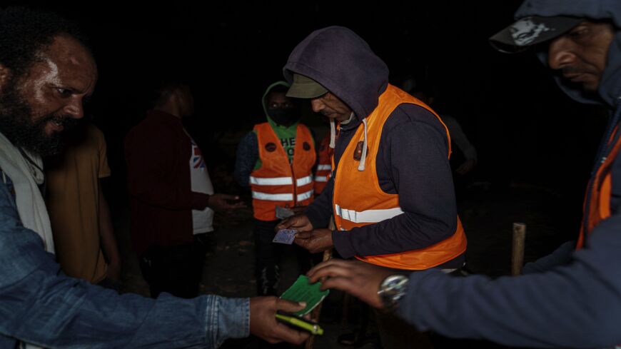 Volunteers check IDs in Addis Ababa, Ethiopia, on Nov. 17, 2021. There are fears emergency measures are leading to the profiling of ethnic Tigrayans.