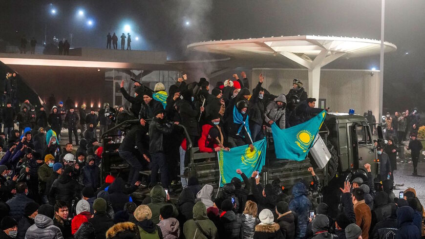 Protesters take part in a rally over a hike in energy prices in Almaty on January 5, 2022. 