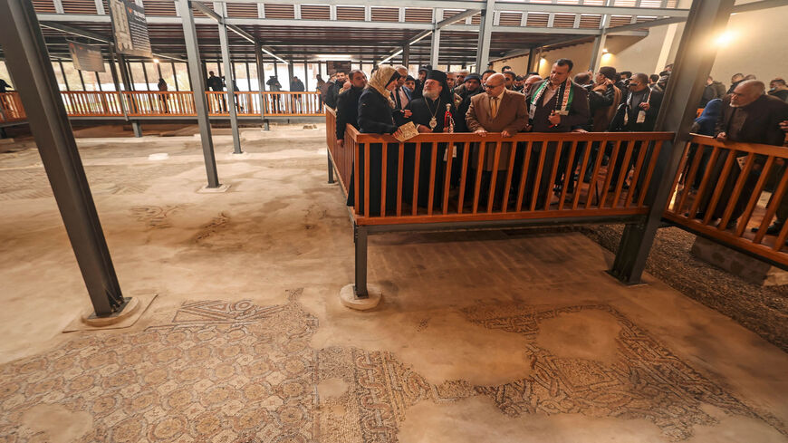 People attend the inauguration of Mukheitim archaeological site, which houses the remnants of a Byzantine church, Jabaliya, in the northern Gaza Strip, Jan. 24, 2022.