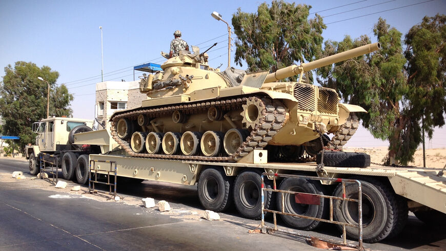 An Egyptian military tank is deployed in the northern Sinai town of Al-Arish on July 16, 2013.