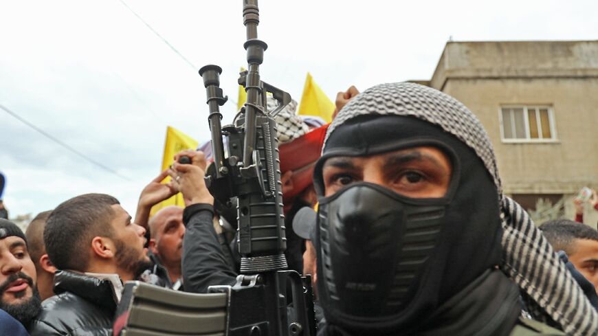 A member of the Fatah movement attends the funeral on February 14, 2022 for Palestinian teenager Mohammed Abu Salah, 17, killed after Israeli forces entered a village near the flashpoint town of Jenin in the occupied West Bank