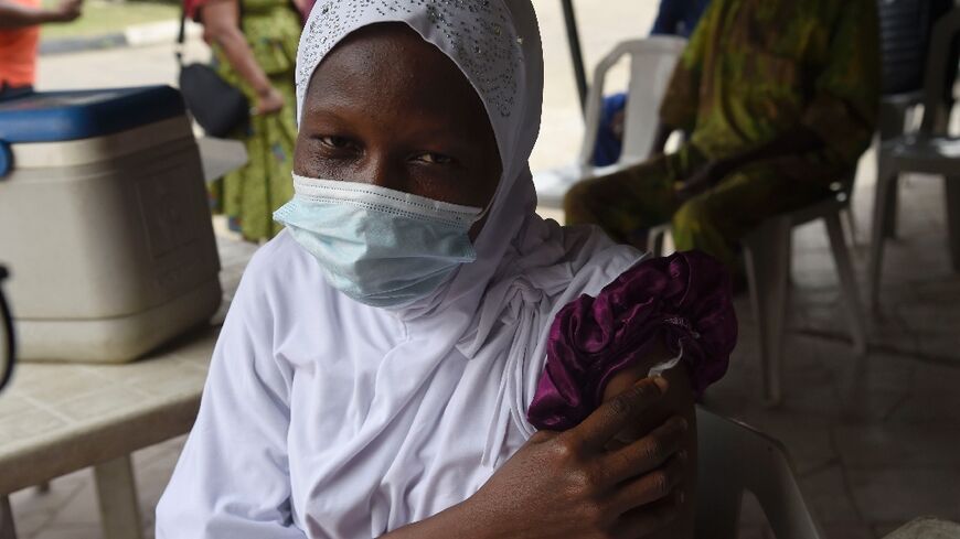 A woman gets her Covid-19 jab at the Secretariat Community Central Mosque, Alausa, Ikeja in Lagos