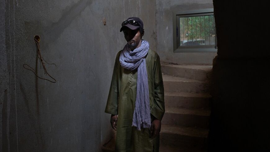 A life in the shadows: This man, who is anonymous, worked for eight months for the jihadists and then fled to a refugee camp in Mauritania. When he was photographed by AFP, he was hiding in a building that was under construction