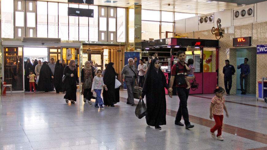 Passengers from Iran arrive to Najaf airport after it reopened on July 16, 2018. 