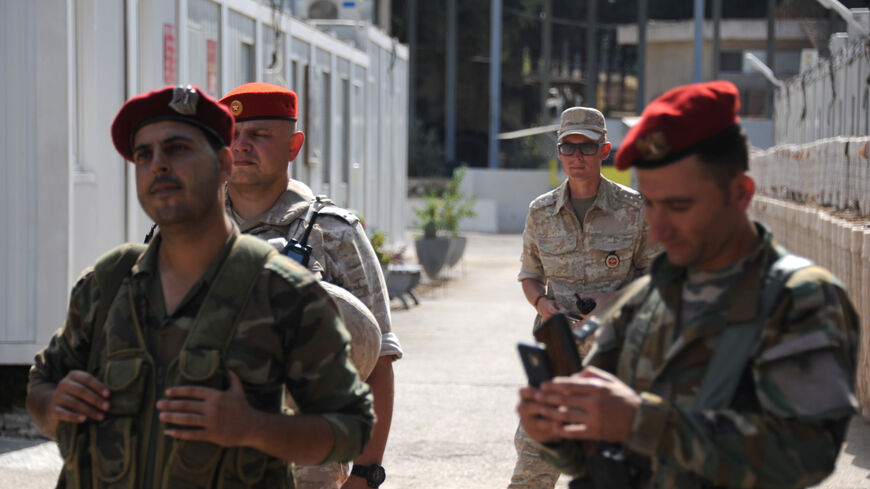 Syrian (front) and Russian soldiers stand at the Russian naval base in the Syrian Mediterranean port of Tartus on Sept. 26, 2019. 