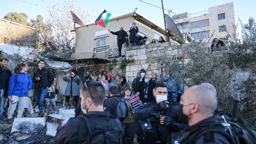 Sheikh Jarrah has become a symbol of Palestinian resistance against Israeli control of Jerusalem; this photo taken on January 21, 2022 shows Israeli security forces deployed as Palestinian, Israeli, and foreign activists demonstrate 