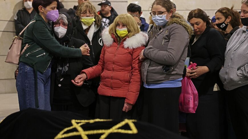 Mourners attend the funeral of Rabbi Moshe Krivitski, who was killed the previous day in a knife attack by a convicted Islamic State group sympathiser, in the southern Israeli city of Beersheba