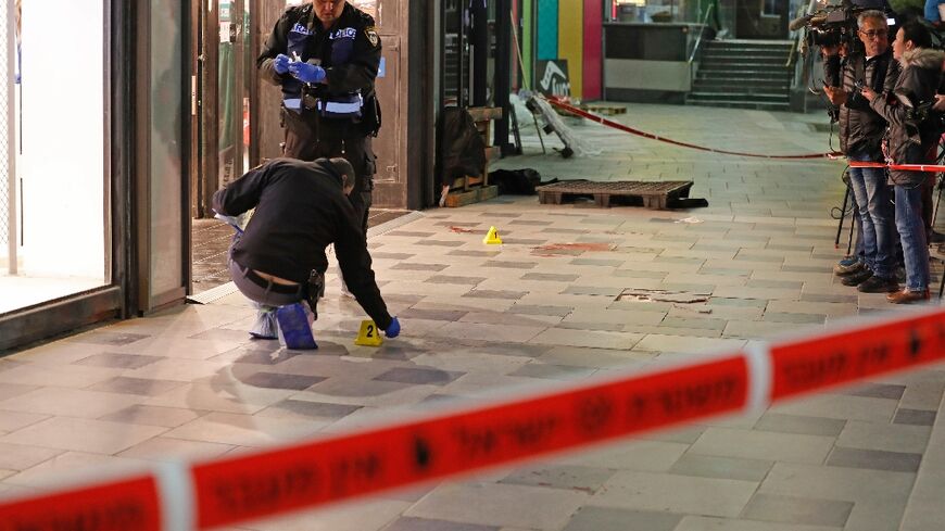 Israeli police cordon off the scene of a knife attack outside a shopping centre in the southern city of Beersheba