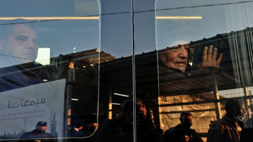 Palestinian workers in a minivan as they leave Beit Hanun in the northern Gaza Strip for the Erez crossing into Israel