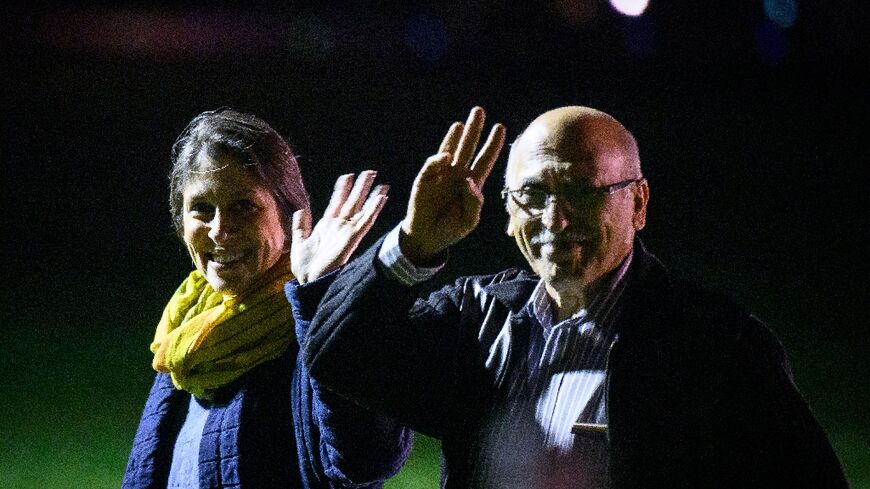 Nazanin Zaghari-Ratcliffe (L) and Anoosheh Ashoori wave after landing at RAF Brize Norton 