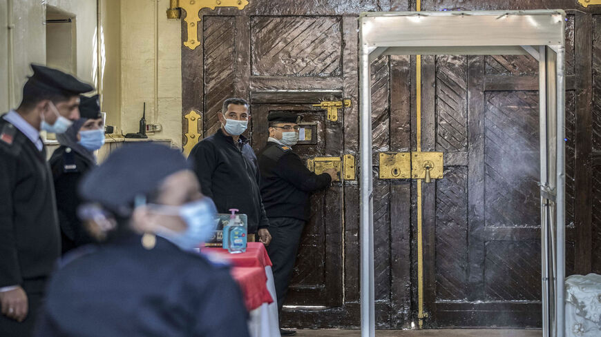 This picture taken during a government-guided tour shows police officers standing at the gate of Al-Qanatir women's prison, Qalyoubiya province, Egypt, Dec. 27, 2020.