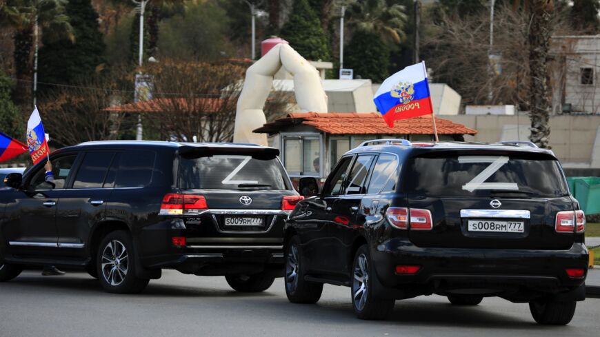 Syrians wave the flag of Russia.