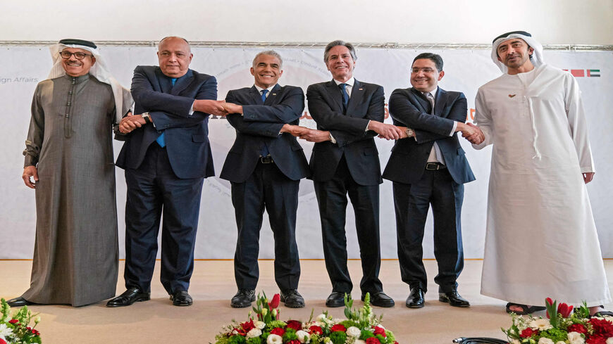 Bahrain's Foreign Minister Abdullatif bin Rashid Al Zayani, Egypt's Foreign Minister Sameh Shoukry, Israel's Foreign Minister Yair Lapid, US Secretary of State Antony Blinken, Morocco's Foreign Minister Nasser Bourita and United Arab Emirates' Foreign Minister Sheikh Abdullah bin Zayed Al Nahyan, pose for a group photo following their Negev meeting in the kibbutz of Sde Boker, Israel, March 28, 2022.