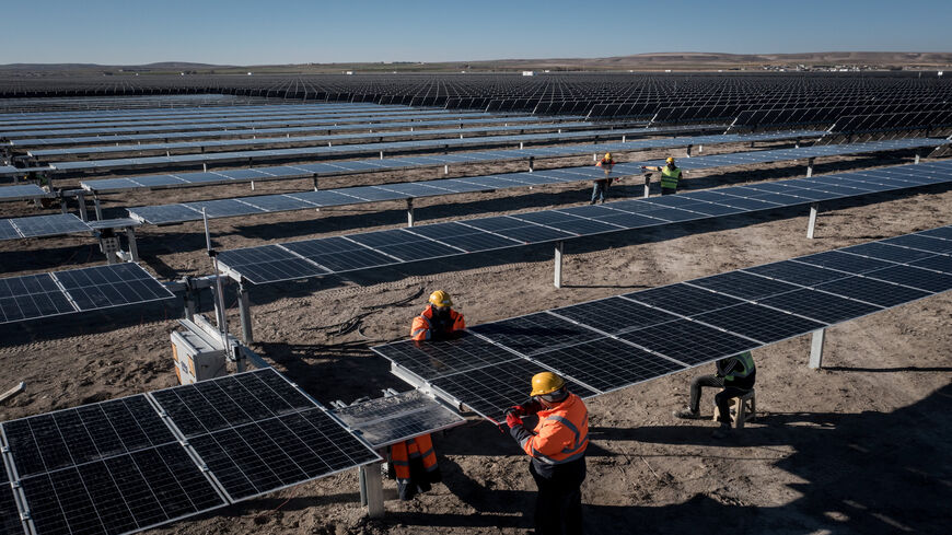 Employees install new solar panels at the Kalyon Energy's Karapinar Solar Power Plant, Karapinar, Turkey,  Dec. 2, 2021.