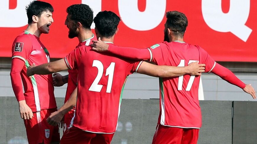 Iranian players celebrate scoring during the 2022 Qatar World Cup Asian Qualifiers football match with Lebanon, at the Imam Reza Stadium in the city of Mashhad