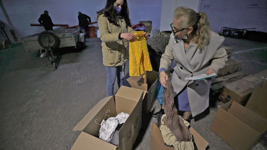 Volunteers gather donated items to welcome refugees fleeing the war in Ukraine in the northern Israeli town of Nof Hagalil, where roughly half the inhabitants speak Russian