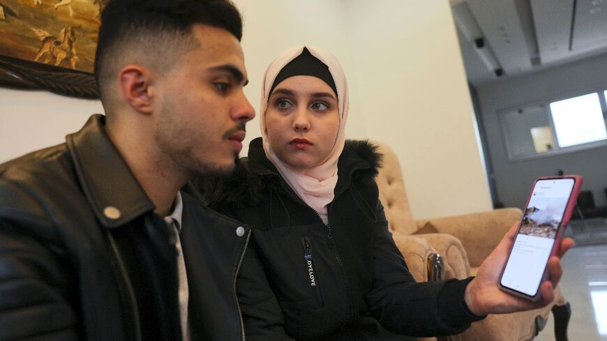 Ukrainian Viktoria Saidam and her Palestinian husband Ibrahim Saidam at their family home in the refugee camp of Bureij in the central Gaza Strip on March 22, 2022