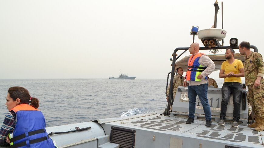 Lebanese soldiers search for survivors off the coast of the northern Lebanese city of Tripoli on April 24, 2022, after an overloaded migrant boat capsized 