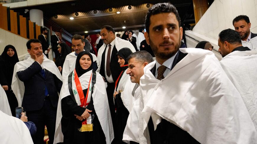 Iraqi members of the Sadrist bloc (of Shiite leader Muqtada al-Sadr) gather inside the Iraqi parliament in the capital, Baghdad.