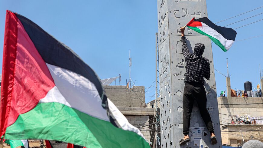 Supporters of the Palestinian Hamas and Islamic Jihad groups rally after Friday prayers in Khan Yunis.