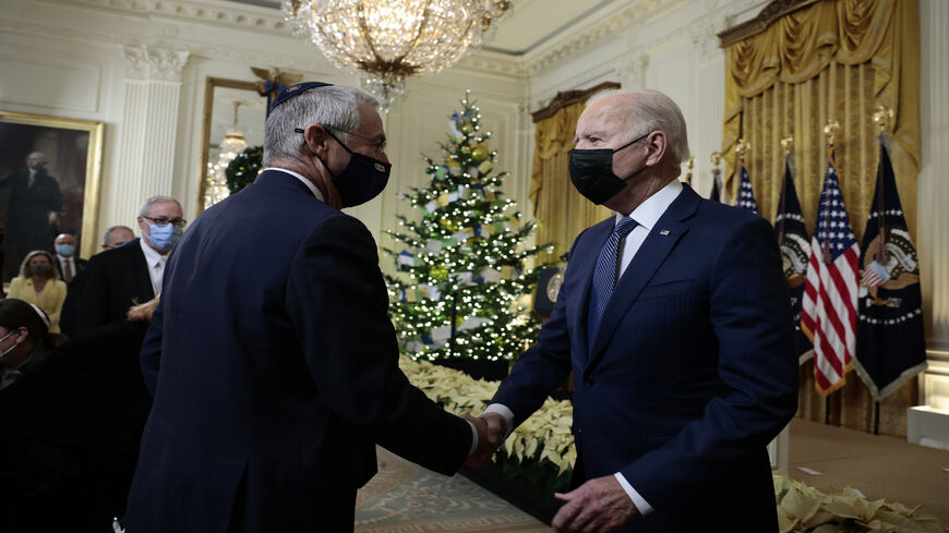 US President Joe Biden shakes hands with Michael Herzog, the Israeli ambassador to the United States, after the menorah lighting ceremony in celebration of Hanukkah in the East Room of the White House, Washington, Dec. 1, 2021.