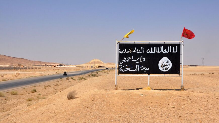 A general view taken on Aug. 13, 2017, shows an Islamic State poster in the central Syrian town of Al-Sukhnah.