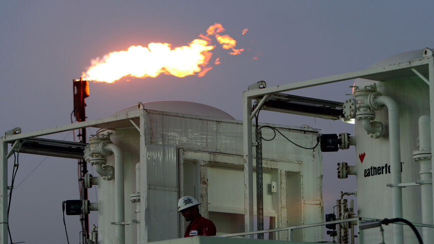 A worker is seen at an oil refinery near the village of Taq Taq, in the autonomous Kurdistan Region of Iraq, May 31, 2009.