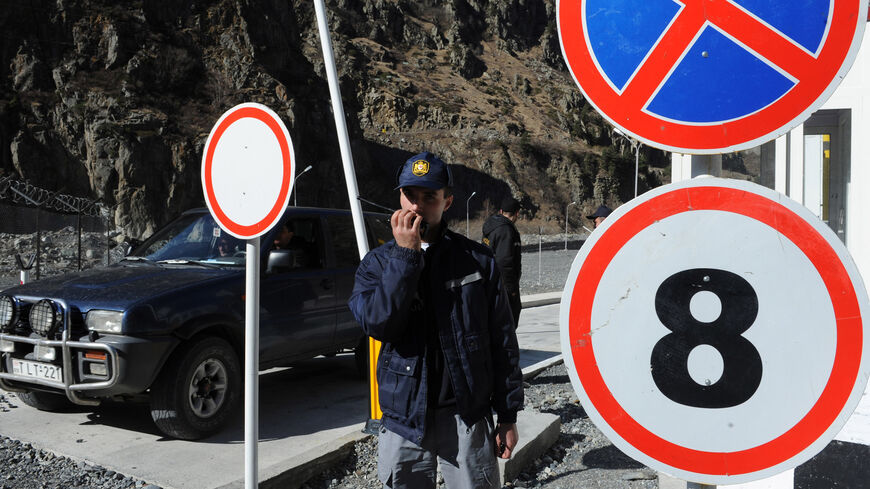 Georgian border guards work at the Darial Gorge (Verkhniy Lars) border crossing, March 1, 2010.