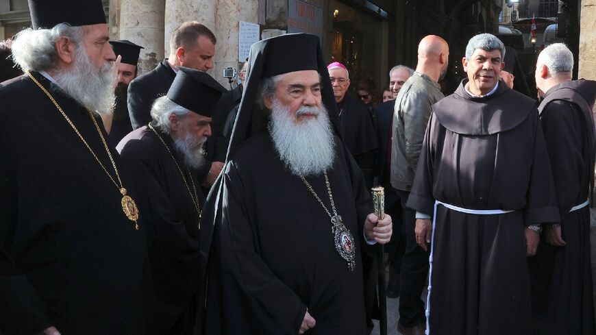 The Greek Orthodox Patriarch of Jerusalem Theophilos III (C) arrives for a meeting with other religious leaders at the Petra Hotel at the Jaffa Gate area in Jerusalem's old city