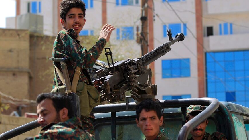 Forces loyal to Yemen's Huthi rebels take part in a military parade in Sanaa marking the seventh anniversary of the Saudi-led coalition's intervention in their country