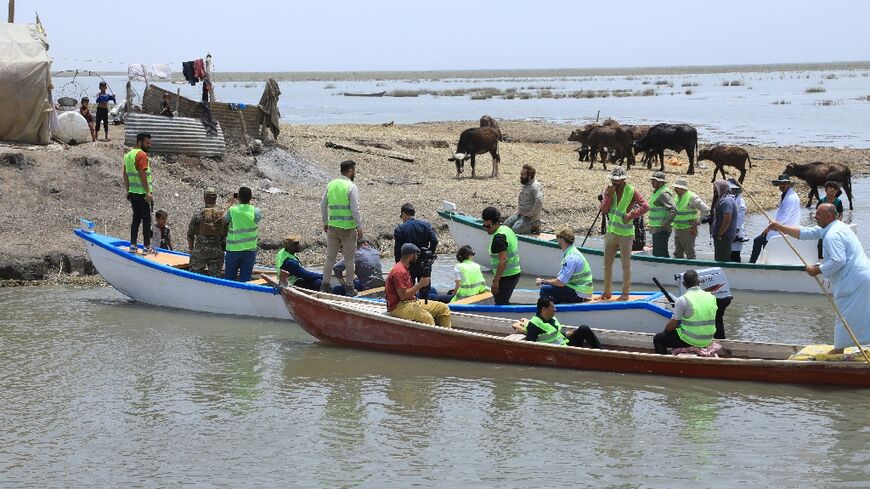 Environmental activists have launched a boat to help collect trash clogging the waters of Iraq's marshes