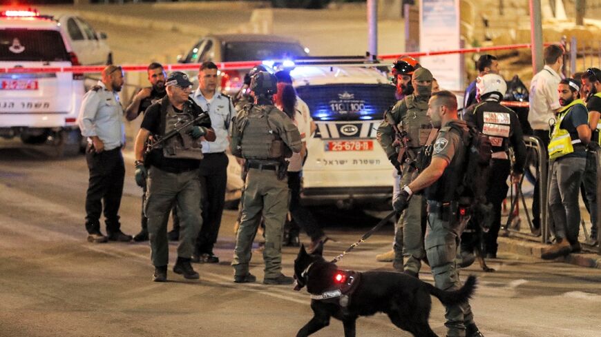 An Israeli border guard is seen at the scene of a stabbing attack at the Damascus Gate of the Old City of Jerusalem 