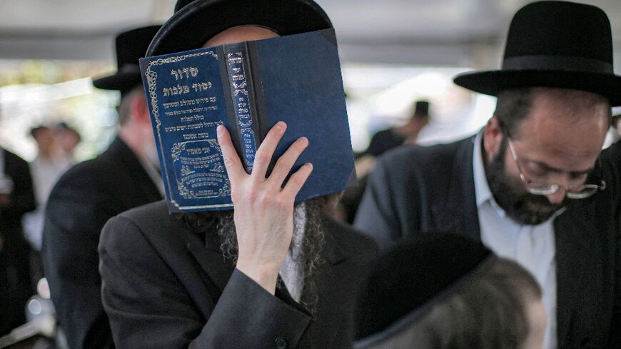 Ultra-Orthodox Jews pray at the gravesite of Rabbi Shimon Bar Yochai at Mount Meron in northern Israel