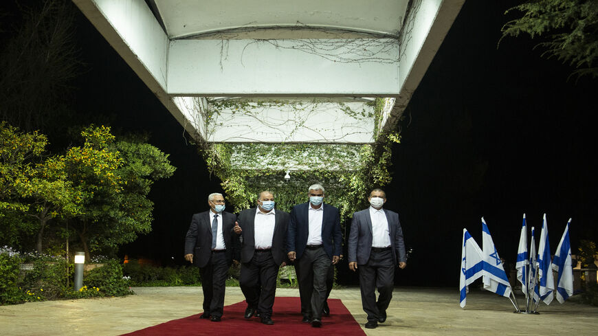 Arab Joint List leader Mansour Abbas and other party members attend a meeting with President Reuven Rivlin at the president's residence, Jerusalem, April 5, 2021.