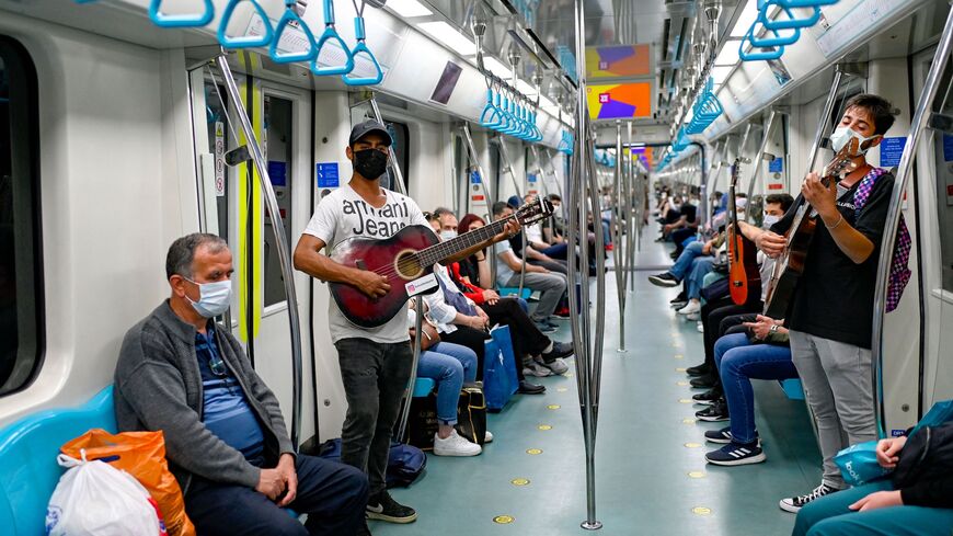 Amateur musicians play in the Istanbul metro during the performance ban due to COVID-19 in Istanbul on June 9, 2021.