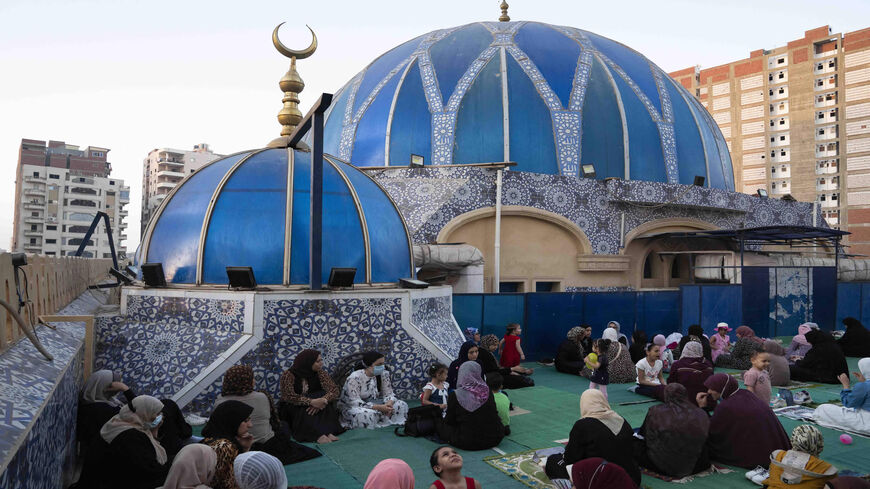 Females gather during morning prayers for Eid al-Adha at Al-Shami Mosque in the Nile Delta city of el-Mahalla el-Kubra, some 120 kilometers (74 miles) north of the capital Cairo, Egypt, July 20, 2021.